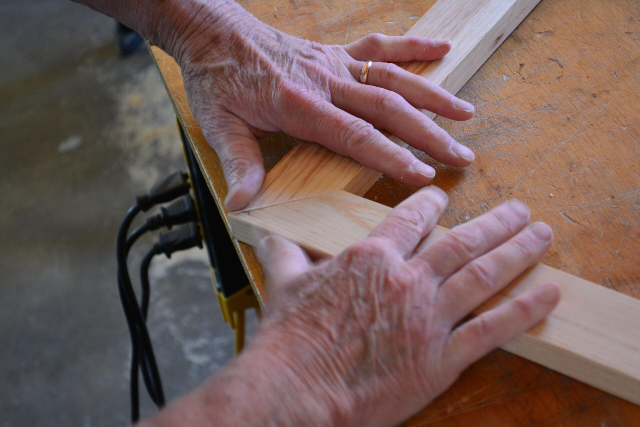 woodworker-5974532 A wood worker building a frame.